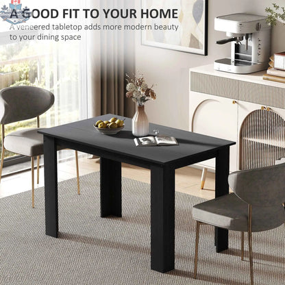 Black Spencer 47-inch dining table by SLOTH Nation with space for 4 to 6 people, perfect for kitchen and dining areas.