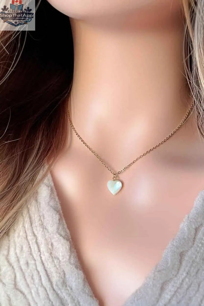 24K gold seashell heart necklace by SLOTH Nation featuring a delicate natural shell pendant on a fine chain.