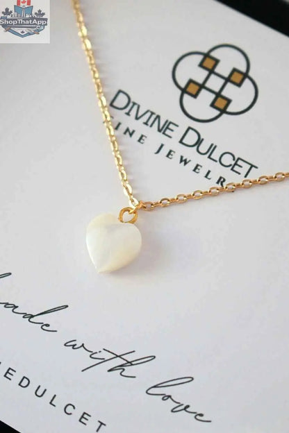 24K gold seashell heart necklace from SLOTH Nation, featuring a delicate seashell pendant on a fine chain.