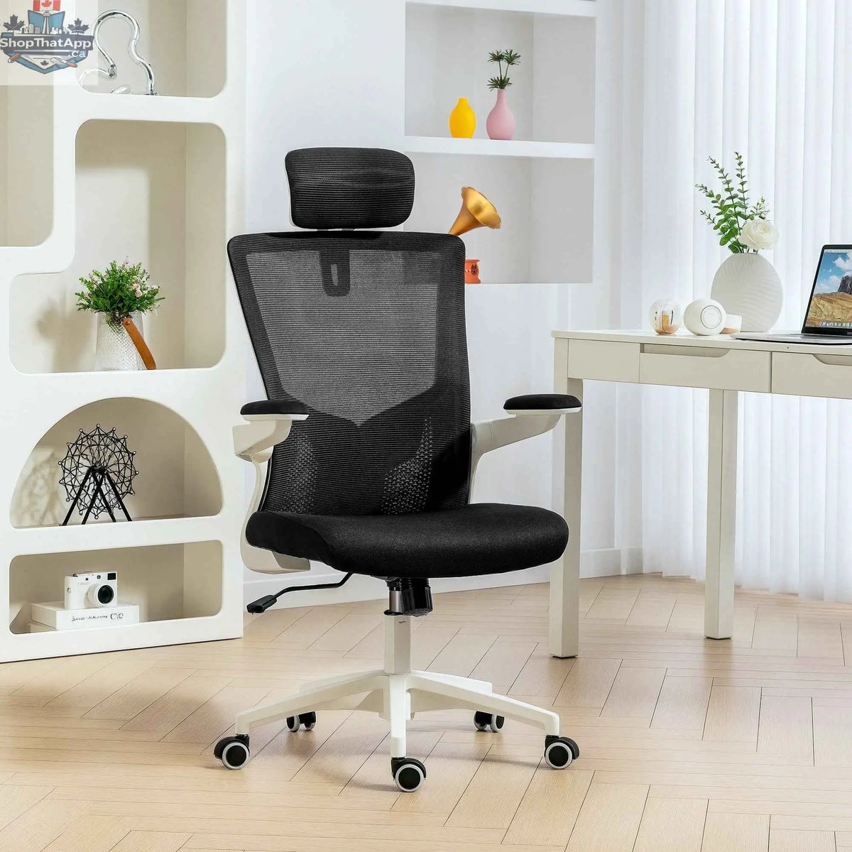 Black and white Andre ergonomic office chair by SLOTH Nation with 2D lumbar support and adjustable headrest for comfort.