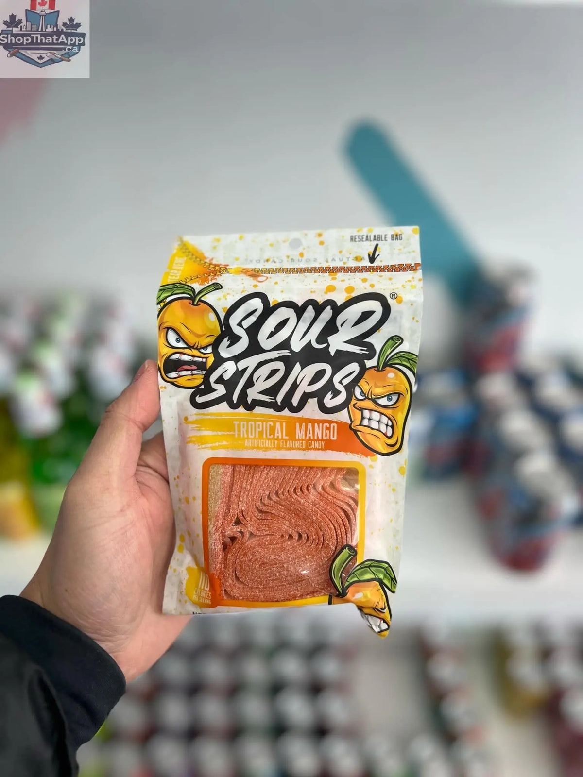 Tropical mango sour candy strips by Snack Bar Co, sweet and tangy chewy tropical fruit-flavored candy in a 96g package.