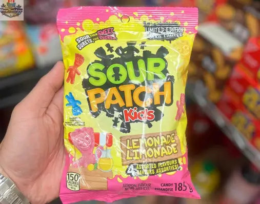 Assorted Sour Patch Kids Lemonade candies in a 185g Snack Bar Co package, featuring bright yellow and colorful candy pieces.