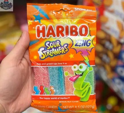 Colorful HARIBO SOUR STREAMERS candy from Snack Bar Co with vibrant, twisted sour gummy strips in a 142g package.