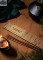 Algonquin Campfire incense sticks from Stopandsmellthecandles, used for relaxation and aromatherapy, with burning incense and smoke.