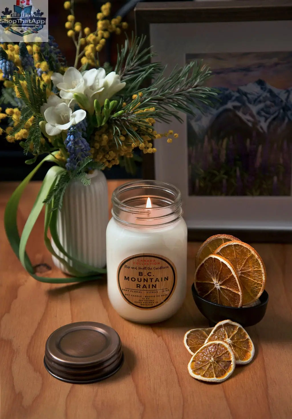 14oz BC Mountain Rain soy candle with cotton wick, featuring refreshing aromatherapy scent from Stopandsmellthecandles, set in a glass jar.