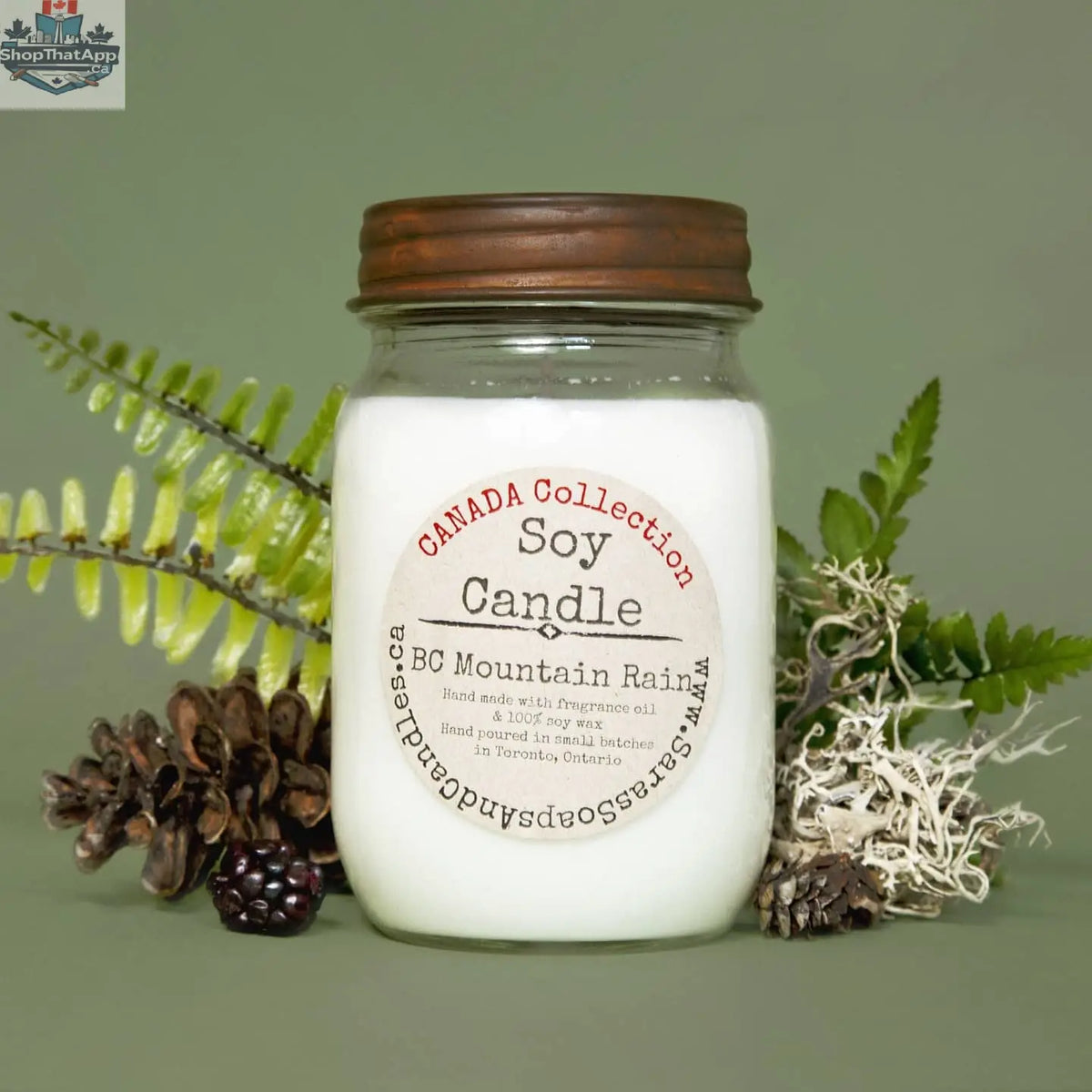 14oz BC Mountain Rain soy candle by Stopandsmellthecandles, showcasing a glass jar with a natural wood wick and mountain-inspired label.