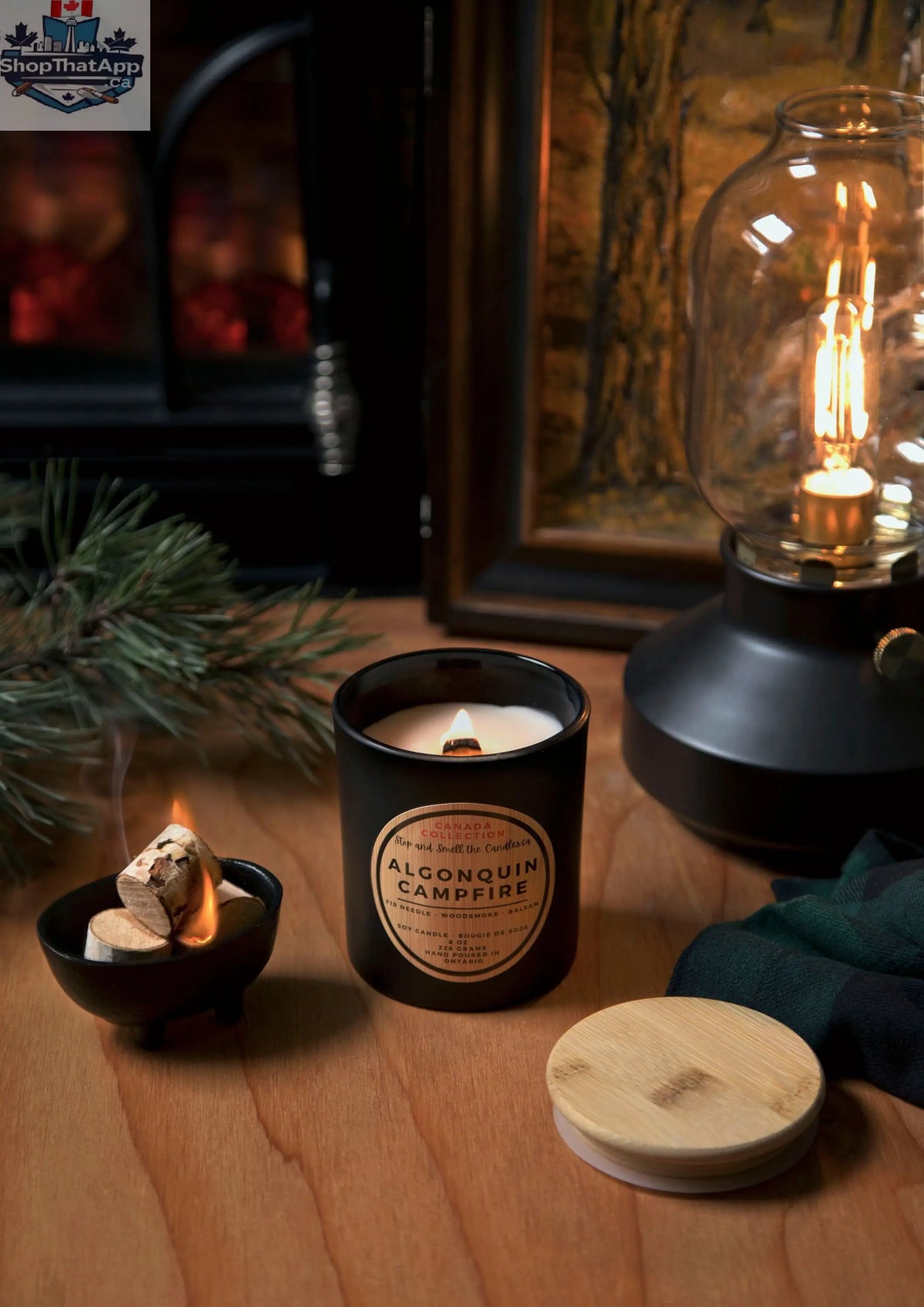 Algonquin Campfire Candle by Stopandsmellthecandles, 8oz soy candle with wood wick and campfire scent, burning with a warm glow.
