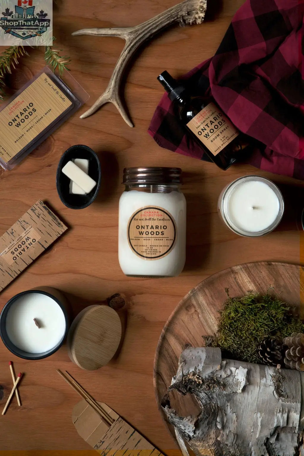 Ontario Woods soy candle in a 14oz jar with a wooden lid, showcasing a rustic label and natural wood accents.