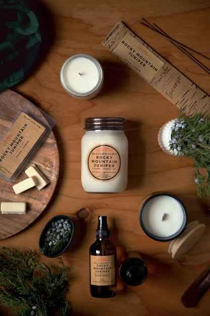 8oz Rocky Mountain Juniper soy candle from Stopandsmellthecandles, featuring a sleek jar and a label with juniper berry design.