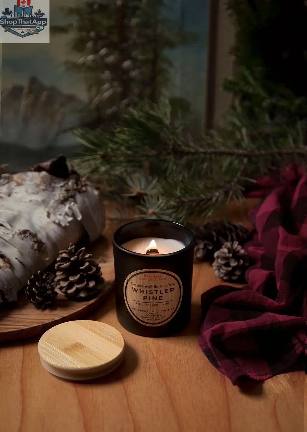 Stopandsmellthecandles Whistler Pine 8oz soy candle with wood wick, showcasing a cozy, rustic pine scent in a glass jar.