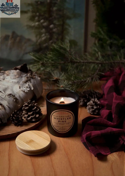 Stopandsmellthecandles Whistler Pine 8oz soy candle with wood wick, showcasing a cozy, rustic pine scent in a glass jar.