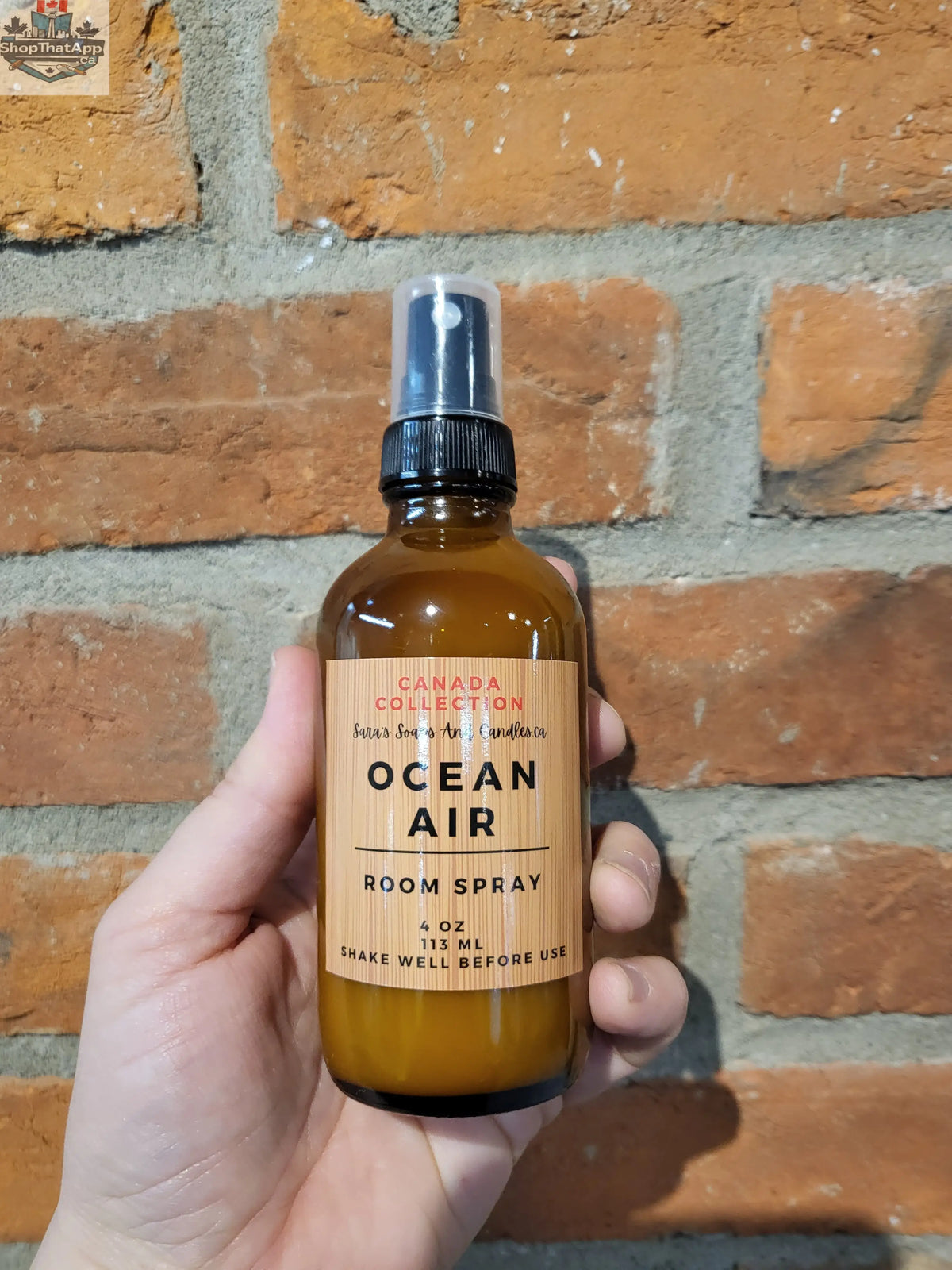 Stopandsmellthecandles room spray bottle with floral label, designed to freshen and scent indoor spaces naturally.