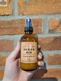 Stopandsmellthecandles room spray bottle with floral label, designed to freshen and scent indoor spaces naturally.
