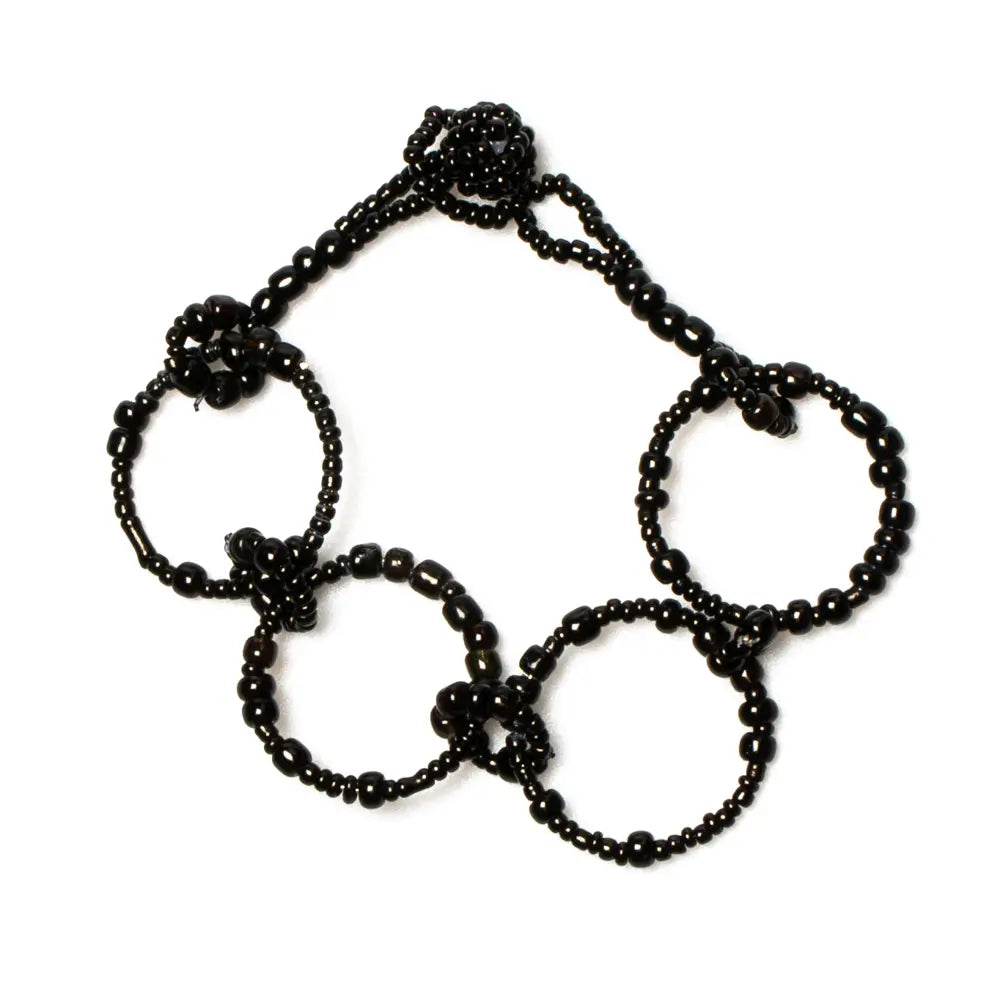 Beaded hoop bracelet by Suzie Blue Canada with colorful beads and silver accents on a white background.