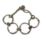 Beaded hoop bracelet by Suzie Blue Canada featuring gray beads and gold accents on a delicate bracelet design.