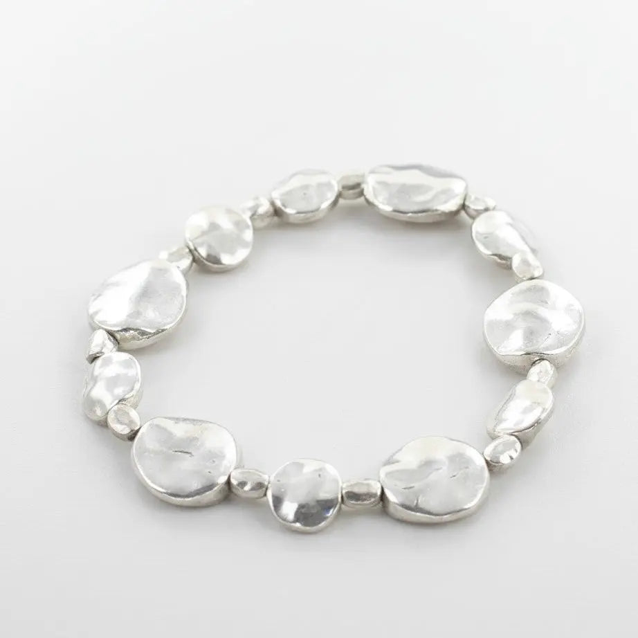 Silver plate beaten disc bracelet by Suzie Blue Canada, featuring a textured, elegant design for versatile occasions.