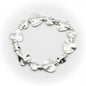 Silver plated beaten heart bracelet by Suzie Blue Canada with a textured heart charm and delicate chain detail.