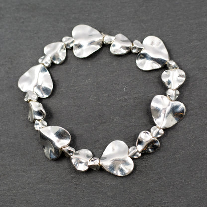 Silver plate beaten heart bracelet by Suzie Blue Canada with a textured, handcrafted heart charm on a delicate chain.