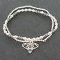 Silver bracelet featuring a double strand elephant pendant from Suzie Blue Canada, showcasing detailed elephant charms on the bracelet.