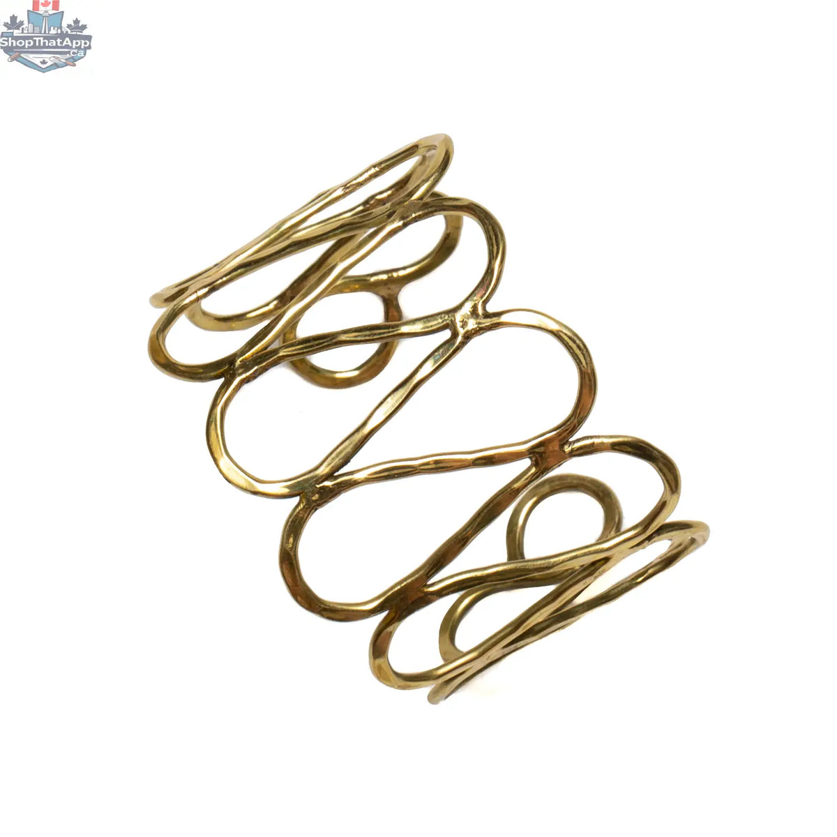 Gold open loop metal cuff bracelet by Suzie Blue Canada, stylish statement jewelry accessory with sleek, modern design.