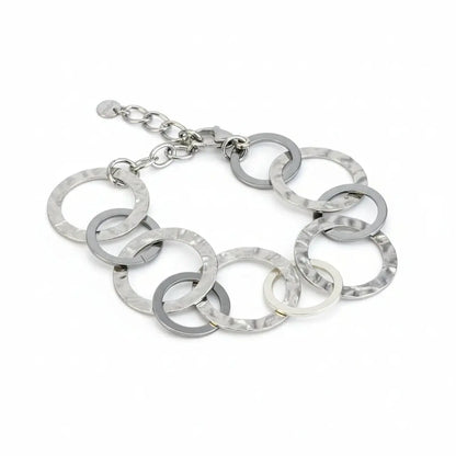 Grey stainless steel linked circle bracelet by Suzie Blue Canada, featuring interconnected circular links for a modern, stylish look.