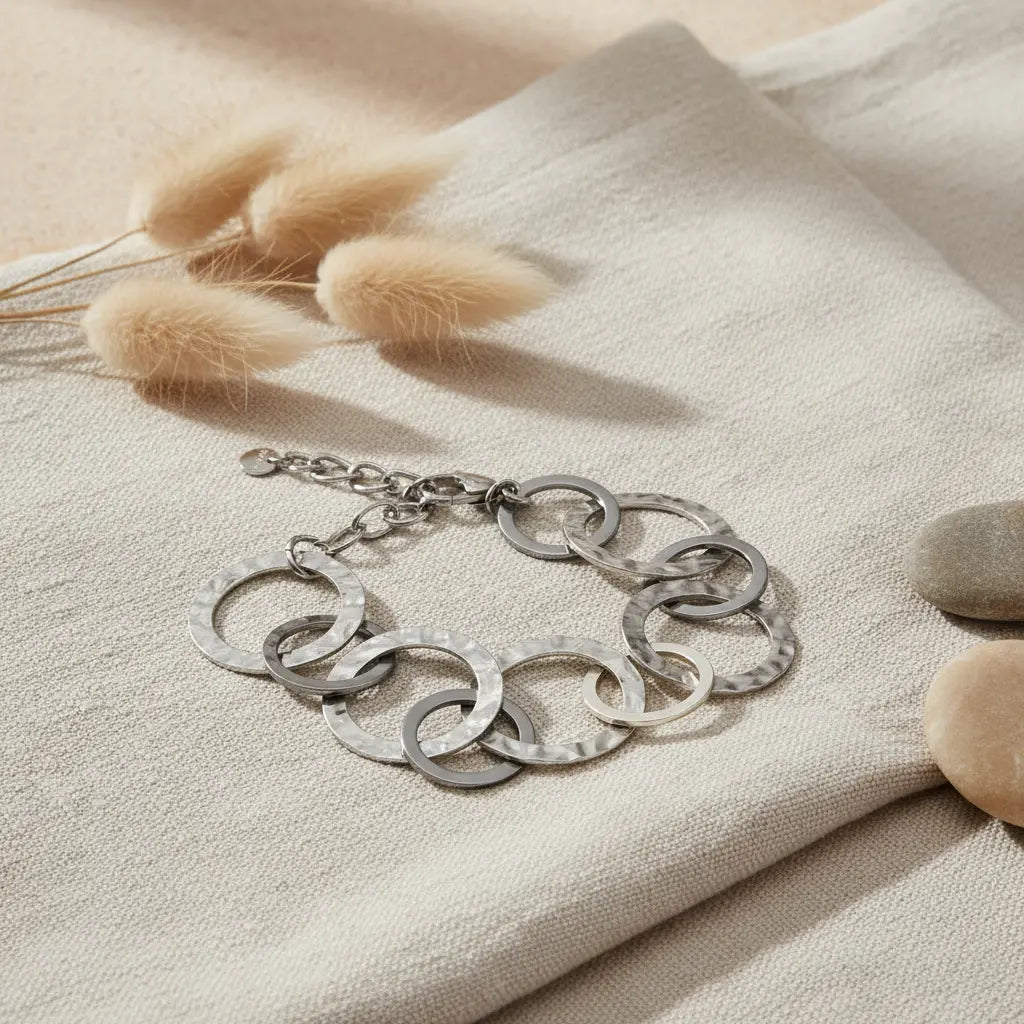 Gray stainless steel Linked Circle Bracelet by Suzie Blue Canada, featuring interconnected circular links on a sleek bracelet.