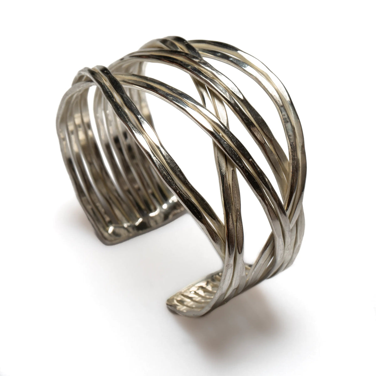 Silver loose plait metal cuff bracelet by Suzie Blue Canada, featuring a stylish braided design on a sleek silver band.