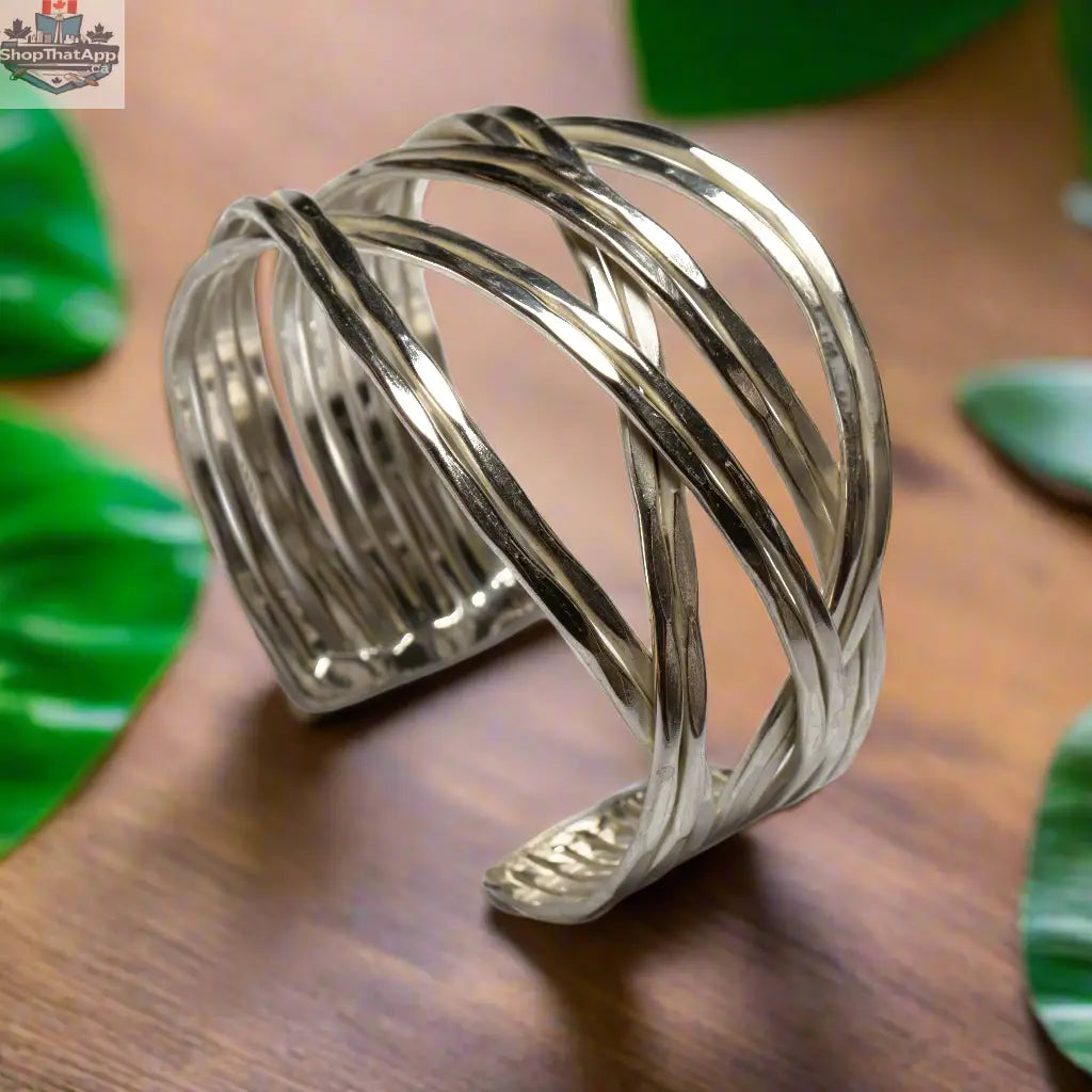 Silver loose plait metal cuff bracelet by Suzie Blue Canada with an open, textured design and a modern, minimalist style.