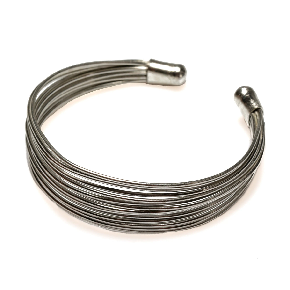 Silver multi-strand wire cuff bracelet by Suzie Blue Canada featuring layered, textured silver strands on a sleek bracelet design.