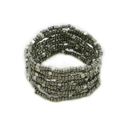 Multi strand stretch cuff bracelet by Suzie Blue Canada featuring layered design and soft fabric strands in neutral tones.