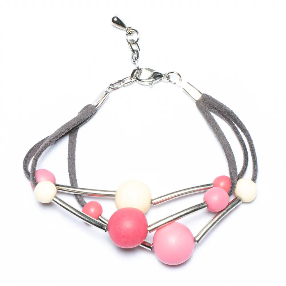 Pink triple strand resin ball bracelet by Suzie Blue Canada featuring colorful resin beads on a stylish bracelet.