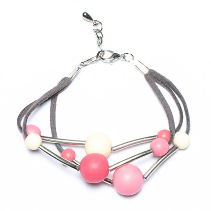 Pink triple strand resin ball bracelet by Suzie Blue Canada featuring colorful resin beads on a stylish bracelet.
