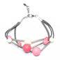 Pink triple strand resin ball bracelet by Suzie Blue Canada featuring colorful resin beads on a stylish bracelet.