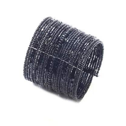 Wide beaded cuff bracelet by Suzie Blue Canada featuring colorful beads and a bold, stylish design on a neutral background.
