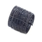 Wide beaded cuff bracelet by Suzie Blue Canada featuring colorful beads and a bold, stylish design on a neutral background.