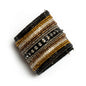 Striped beaded cuff bracelet by Suzie Blue Canada featuring colorful beads and a stylish, unique design on a white background.