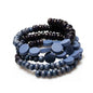 Handmade wood and resin spiral bracelet by Suzie Blue Canada, featuring a unique, artistic design in natural tones.
