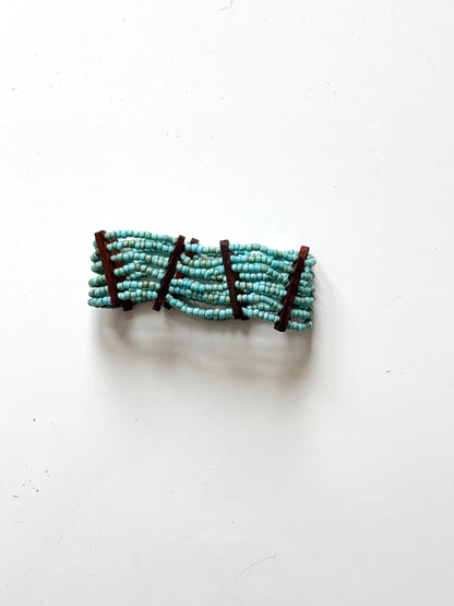 Elasticated bead bracelet with wood detail by Suzie Blue Canada, featuring natural beads and stylish design.