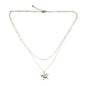 Silver plated double strand star necklace featuring layered star charms, displayed on a neutral background.