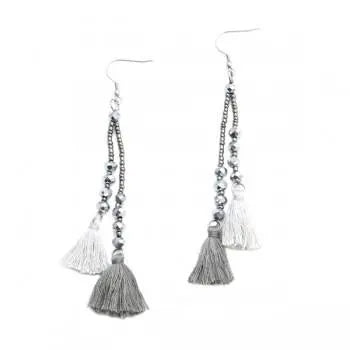Suzy Blue Canada double tassel earrings with crystal drop, elegant jewelry accessory with gold-toned tassels and sparkling crystal accents.
