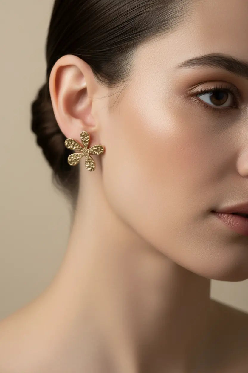 Gold stainless steel flower earrings with beaten metal texture, stylish jewelry by Suzie Blue Canada