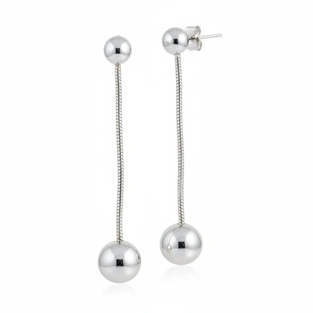 Grey stainless steel hanging ball stud earring by Suzie Blue Canada, close-up view showcasing sleek design and metallic finish.