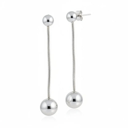 Grey stainless steel hanging ball stud earring by Suzie Blue Canada, close-up view showcasing sleek design and metallic finish.