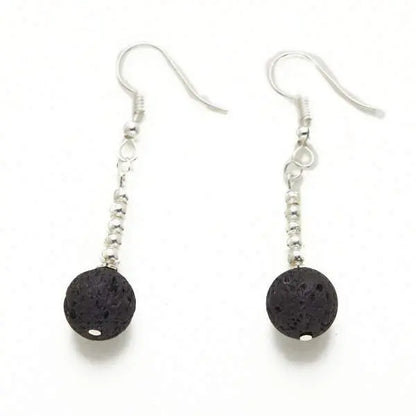 Silver plate lava stone earrings featuring round black lava stones and silver hooks, stylish jewelry by Suzie Blue Canada.