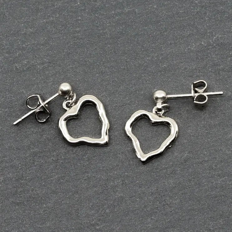 Elegant open heart silver earrings with a drop design by Suzie Blue Canada, featuring a sleek and stylish jewelry piece.