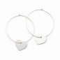 Silver heart hoop earrings by Suzie Blue Canada featuring a silver plate heart charm on classic hoop earring design