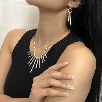 Silver plate double drop earrings by Suzie Blue Canada featuring elegant, shimmering design with layered drops and polished finish.