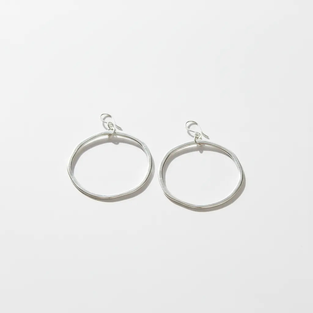 Silver plated hoop earrings by Suzie Blue Canada, stylish and shiny jewelry with a classic hoop design.