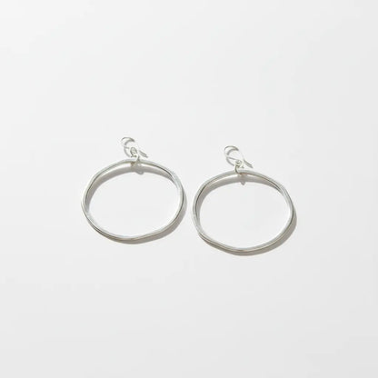 Silver plated hoop earrings by Suzie Blue Canada, stylish and shiny jewelry with a classic hoop design.