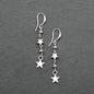 Silver star drop earrings with double drop design by Suzie Blue Canada, featuring charming silver plating and elegant style.